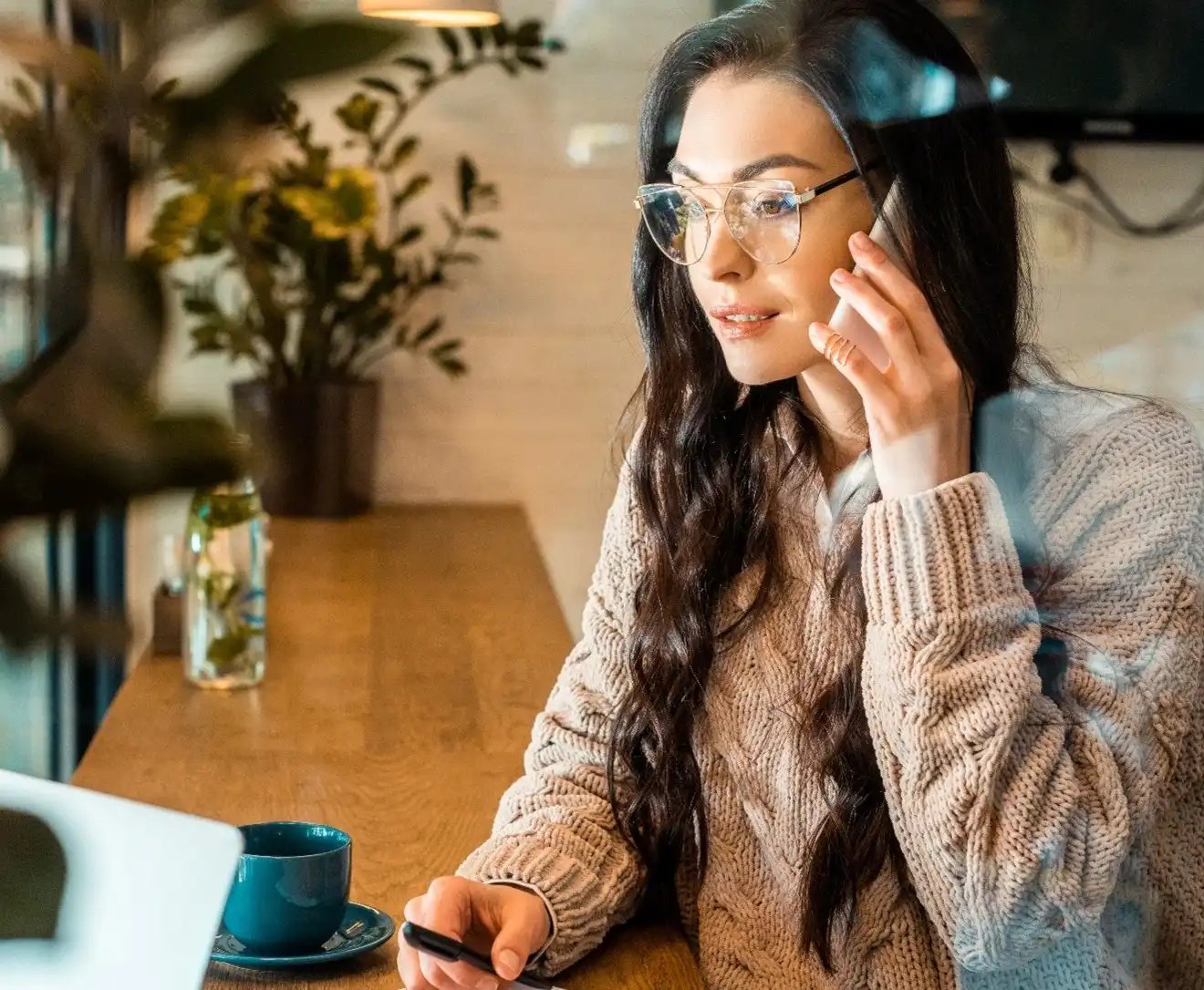 Woman on phone working